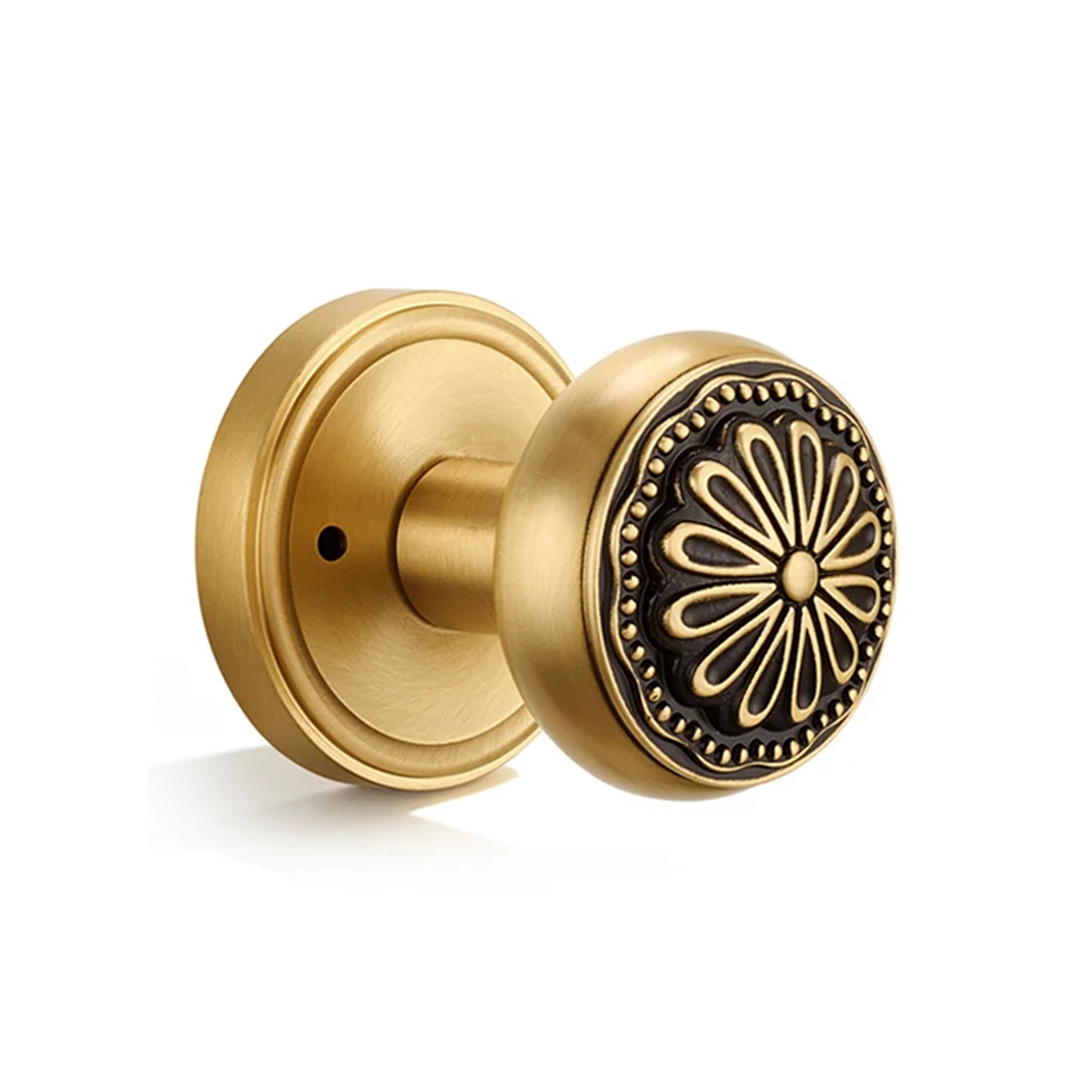 Flirabbit brushed brass floral privacy door knob with black medallion on white background