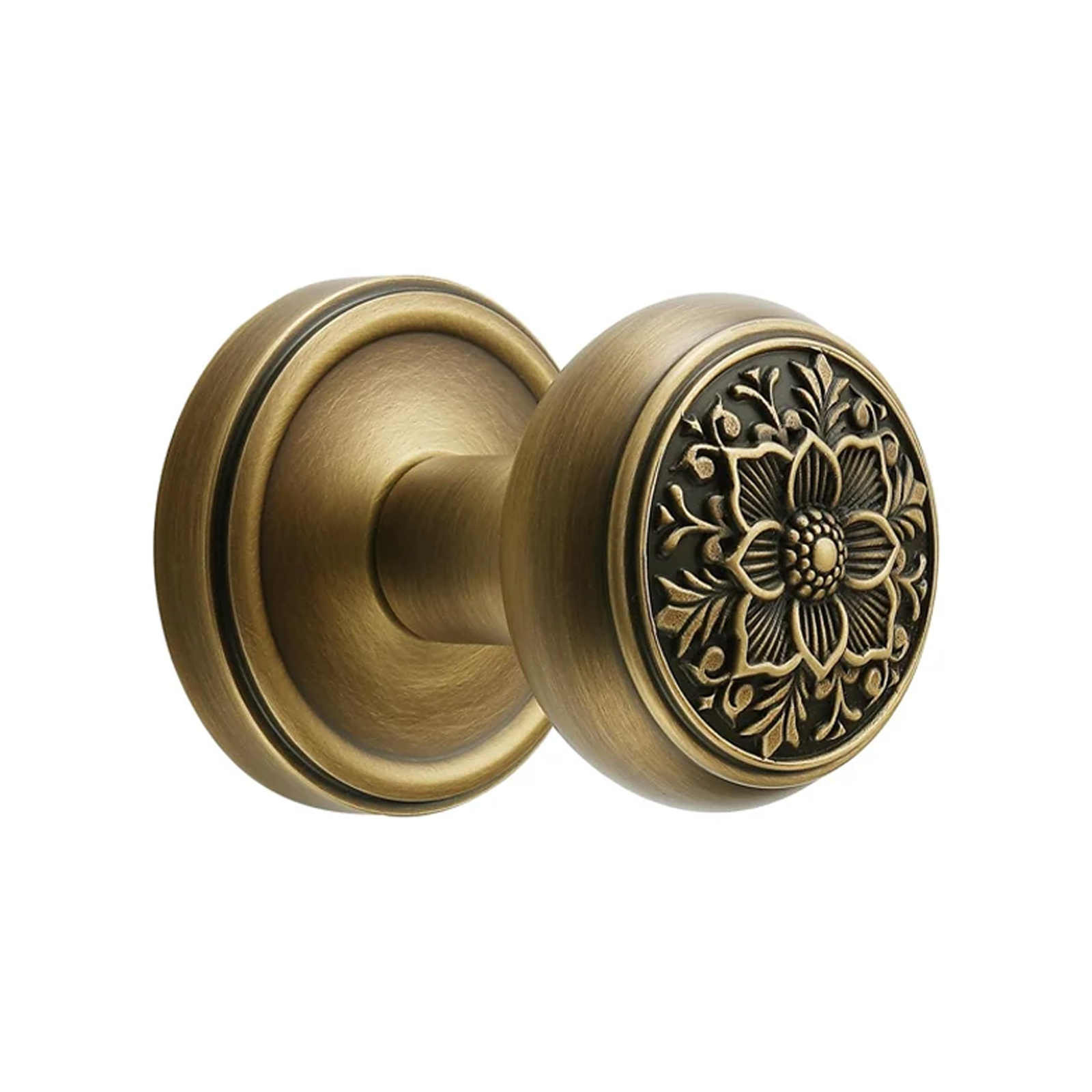 Antique brass floral dummy door knob with round rosette on white background